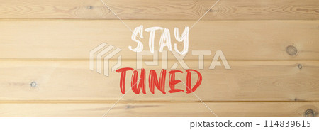 Stay tuned symbol. Concept words Stay tuned on beautiful wooden wall. Beautiful wooden wall background. Business, support, motivation, psychological and stay tuned concept. Copy space. 114839615