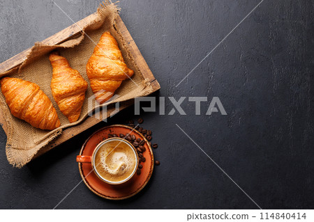 Cappuccino coffee and fresh croissants Cappuccino coffee and fresh croissants 114840414