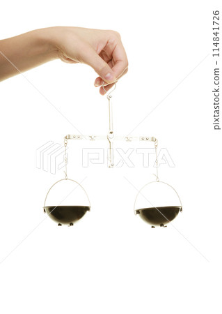 Law court. Female hand holds scales symbol of justice. 114841726