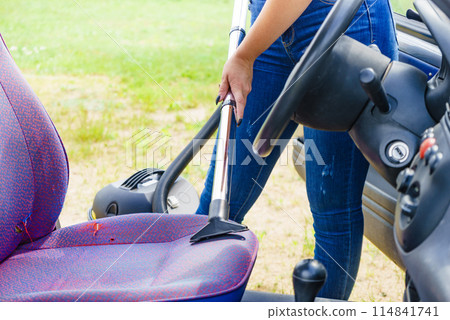 Cleaning car interior with vacuum cleaner Cleaning car interior with vacuum cleaner 114841741