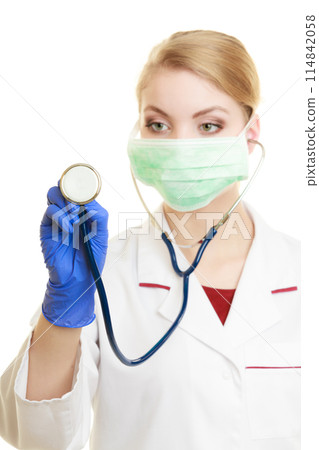 Young woman doctor in face surgical mask Young woman doctor in face surgical mask 114842058