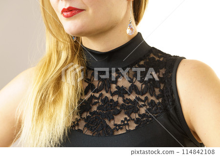 Woman wearing black top 114842108
