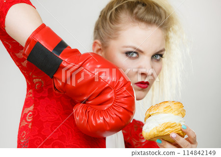 Woman boxing cream cupcake 114842149