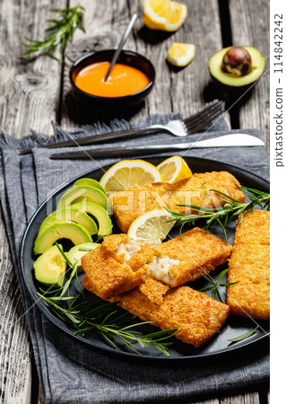 crispy baked battered pollock fillet on a plate crispy baked battered pollock fillet on a plate 114842242