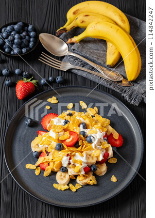 fresh berries, banana with corn flakes and yogurt fresh berries, banana with corn flakes and yogurt 114842247