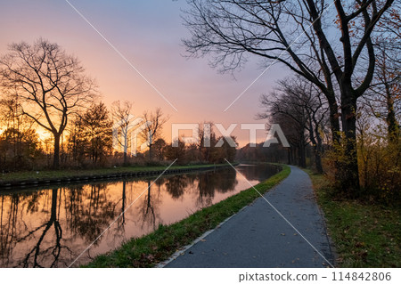 Sunset Glow along the Riverside Path Sunset Glow along the Riverside Path 114842806