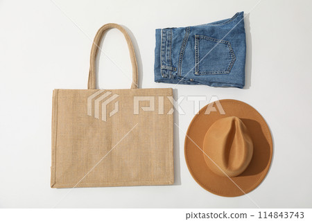 A bag with jeans and a hat 114843743