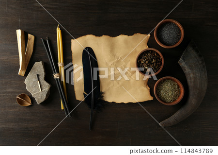 A set of magical things on a dark table. A set of magical things on a dark table. 114843789