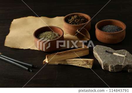 A set of magical things on a dark table. A set of magical things on a dark table. 114843791