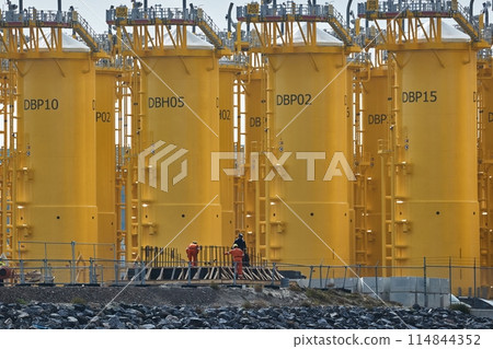 Offshore wind turbine steel base platforms under construction 114844352