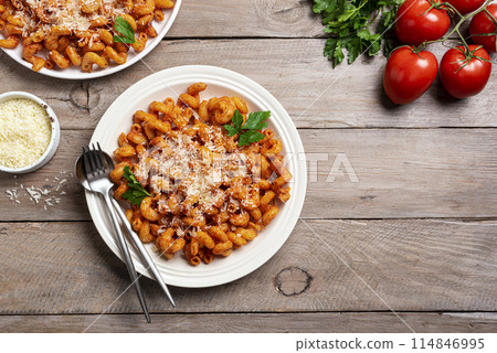 Cavatappi pasta with tomato sauce and parmesan cheese Cavatappi pasta with tomato sauce and parmesan cheese 114846995