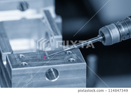 The CMM probe measuring the mold parts on machining center. The CMM probe measuring the mold parts on machining center. 114847349