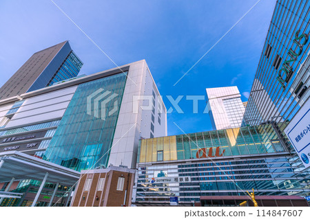 Yokohama cityscape in Japan. The west exit of Yokohama Station in May. View of Yokohama Station and JR Yokohama Tower. (23rd) Yokohama cityscape in Japan. The west exit of Yokohama Station in May. View of Yokohama Station and JR Yokohama Tower. (23rd) 114847607