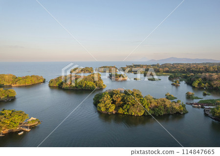 Lake coast landscape with mountain volcano background 114847665