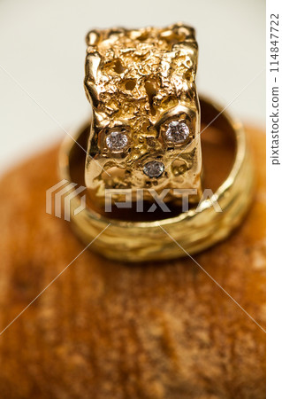 Handcrafted gold wedding bands with diamonds are perfect for your special celebration 114847722