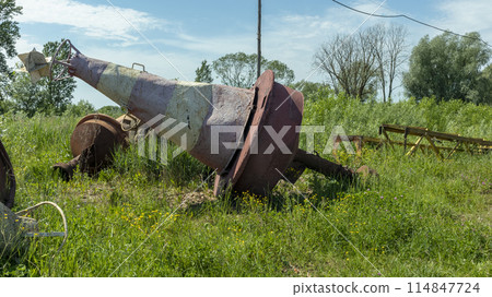 old and rusty used and lie on the Bank in the grass 114847724