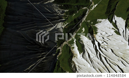 Top view of picturesque mountain peak. Clip. Frozen stone formations and green grass. 114848584
