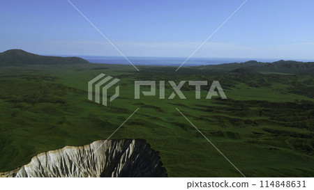 Aerial view of summer green valley and stony cleft. Clip. Flying above stunning summer hilly region. Aerial view of summer green valley and stony cleft. Clip. Flying above stunning summer hilly region. 114848631