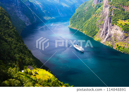 A big cruise liner in clear azure water of Sunnylvsfjorden fjord 114848891