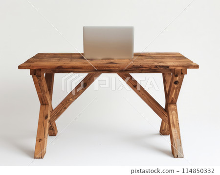 A minimalist style wooden table, featuring an open laptop placed on the surface. A minimalist style wooden table, featuring an open laptop placed on the surface. 114850332