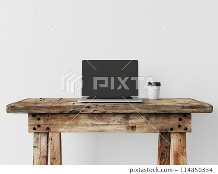 A minimalist style wooden table, featuring an open laptop placed on the surface. A minimalist style wooden table, featuring an open laptop placed on the surface. 114850334