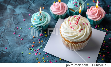 a birthday cupcake with a lit candle on it a birthday cupcake with a lit candle on it 114850349