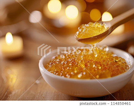 Yellow bowl filled with sweet honey, ready for dipping 114850461