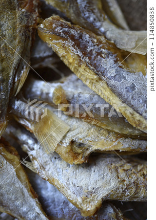 Dried fish for beer. Slices of chopped fish as an appetizer. 114850838