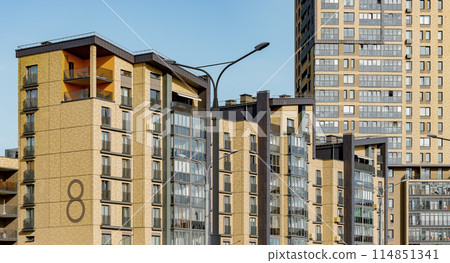 Modern apartment building. Residential house balcony, new condominium complex exterior. Luxury Modern apartment building. Residential house balcony, new condominium complex exterior. Luxury 114851341