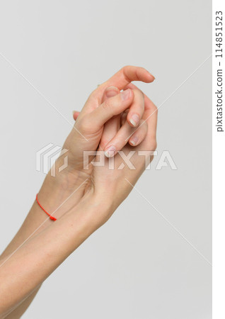 Close-up of female hands on a white background. 114851523