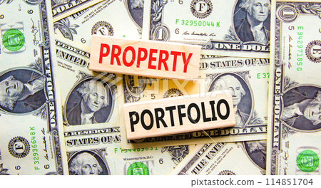 Property portfolio symbol. Concept words Property portfolio on beautiful wooden block. Beautiful dollar bills background. Dollar bills. Business Property portfolio concept. Copy space. Property portfolio symbol. Concept words Property portfolio on beautiful wooden block. Beautiful dollar bills background. Dollar bills. Business Property portfolio concept. Copy space. 114851704