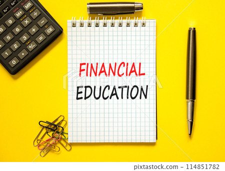 Financial education symbol. Concept words Financial education on beautiful white note. Beautiful yellow paper background. Calculator. Black pen. Business Financial education concept. Copy space. Financial education symbol. Concept words Financial education on beautiful white note. Beautiful yellow paper background. Calculator. Black pen. Business Financial education concept. Copy space. 114851782