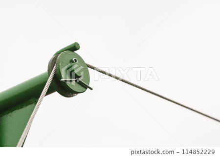 Metal rope hooked on the reel Metal rope hooked on the reel 114852229