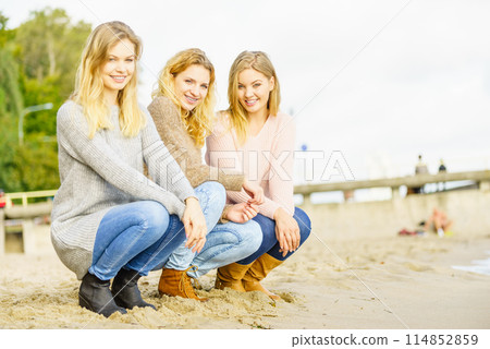 Three fashionable models outdoor 114852859