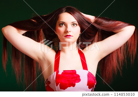 Long haired woman creating coiffure. Long haired woman creating coiffure. 114853010