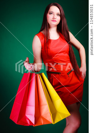 Woman with shopping bags. 114853031