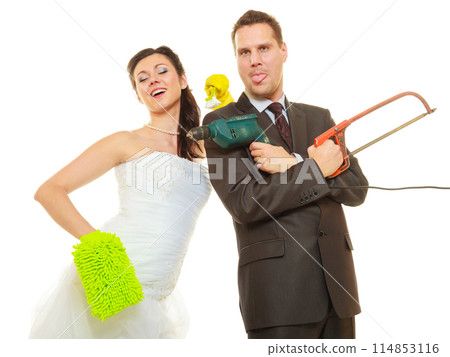 Bride and groom sharing household duties Bride and groom sharing household duties 114853116
