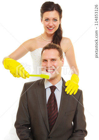 Bride and groom sharing household duties Bride and groom sharing household duties 114853126