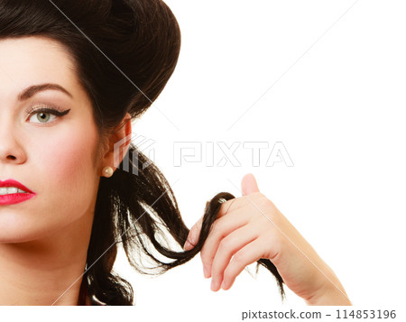 Retro. Coquette pinup girl playing with hair 114853196