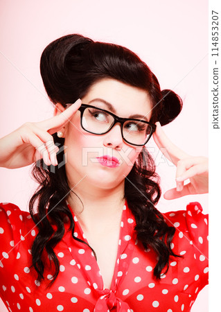 Retro. Pensive thoughtful pinup girl in eyeglasses Retro. Pensive thoughtful pinup girl in eyeglasses 114853207