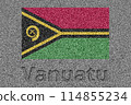 The Vanuatu flag painted on a stone slab with the word "Vanuatu" carved into it 114855234
