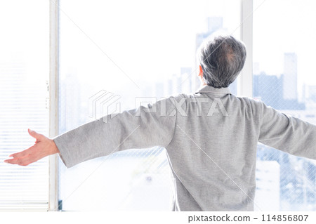 Senior man in pajamas, back view Senior man in pajamas, back view 114856807