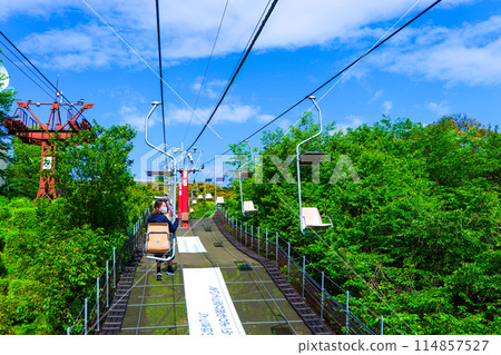 Woman riding on a ropeway 114857527