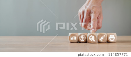 Value chain concept, Hand holding wooden block on desk with value chain icon on virtual screen. Value chain concept, Hand holding wooden block on desk with value chain icon on virtual screen. 114857771