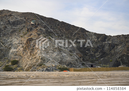 A traditional Arab tent near the mountains on the shore of Gulf of Oman on Arabian Peninsula in UAE 114858384