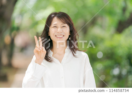 Middle aged woman 114858734