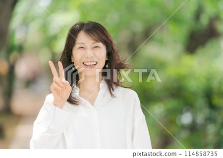 Middle aged woman 114858735