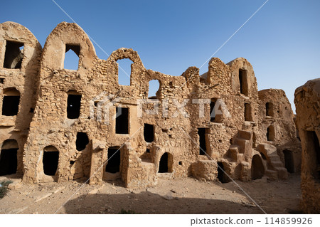 Uninhabited fortified village with houses and granaries, Tunisia. Ksar of Mgabla, Berber, Tataouine. Uninhabited fortified village with houses and granaries, Tunisia. Ksar of Mgabla, Berber, Tataouine. 114859926