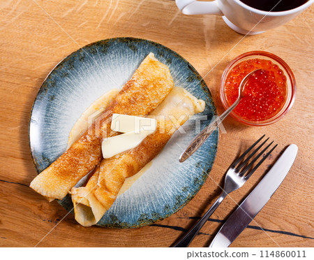 Pancakes served with red caviar and butter Pancakes served with red caviar and butter 114860011