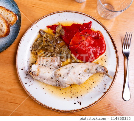 Roasted rabbit served with potato and vegetables Roasted rabbit served with potato and vegetables 114860335